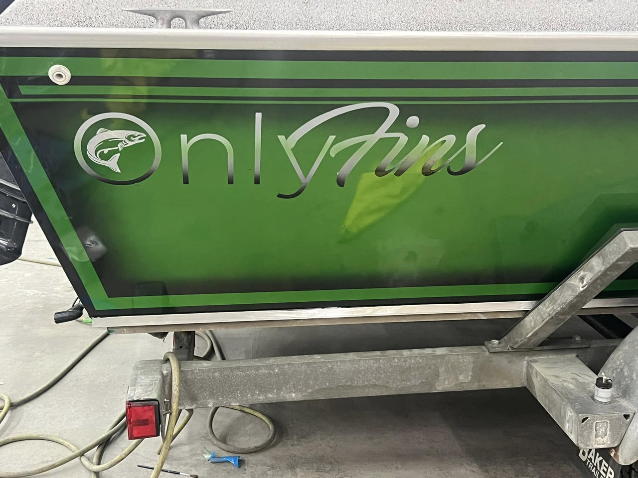 Custom-painted boat with OnlyFins graphics