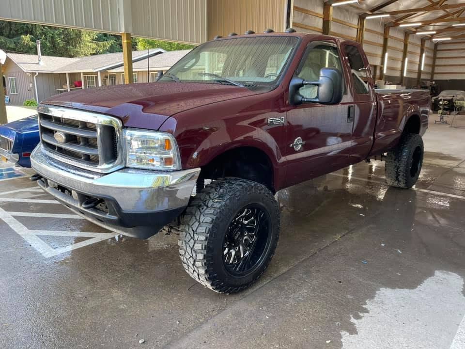 Lifted Ford F-250 on aftermarket wheels at Howerton's Custom Creations