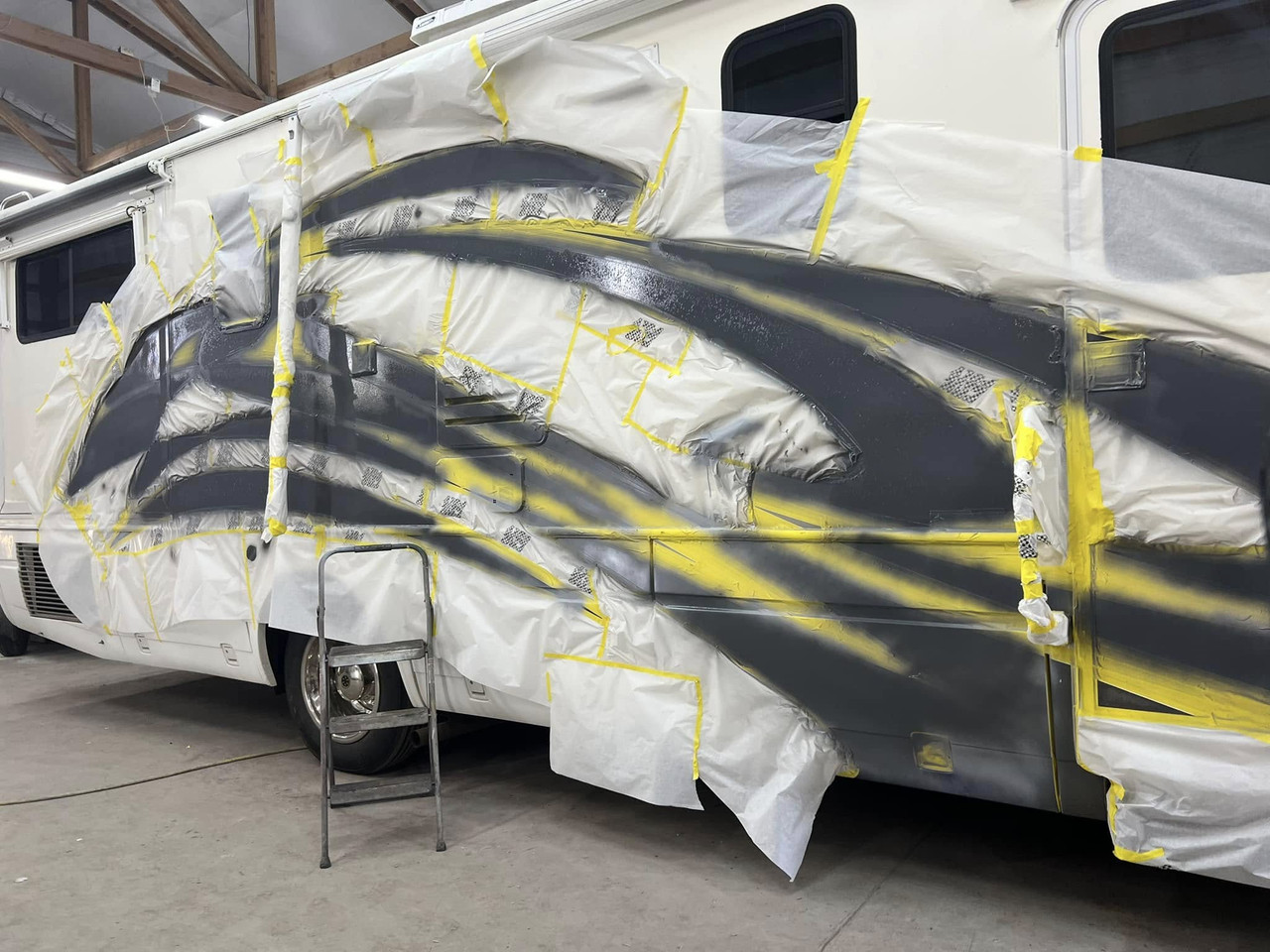 Motorhome masked for repaint — before